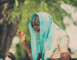 A woman in the embrace a village program worships